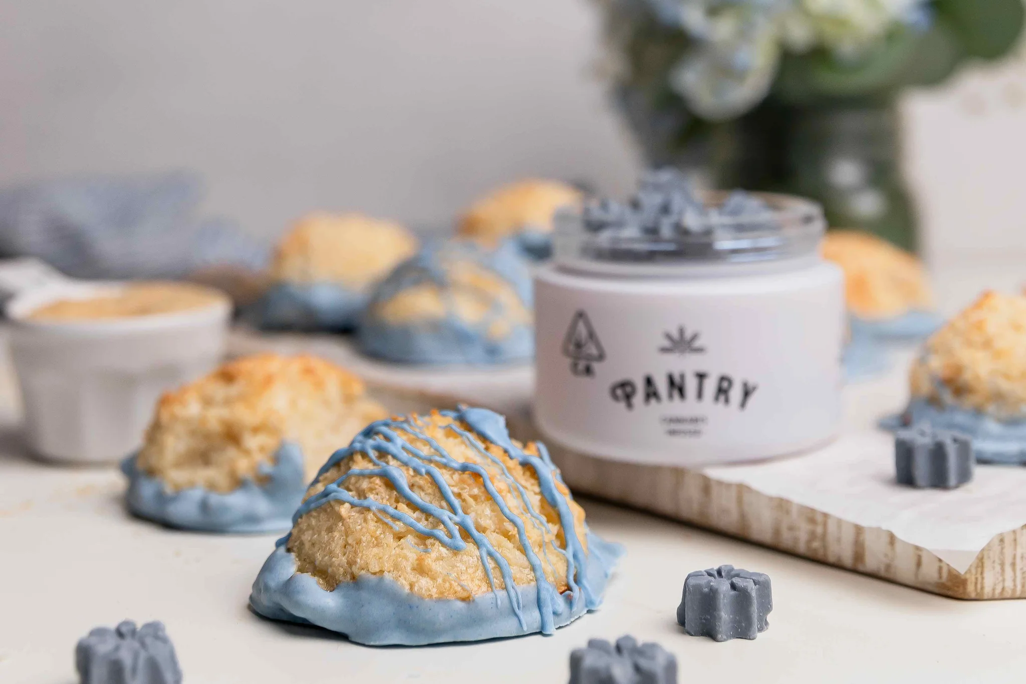 chocolate drizzled macaroon with Pantry jar and glow bites in the background