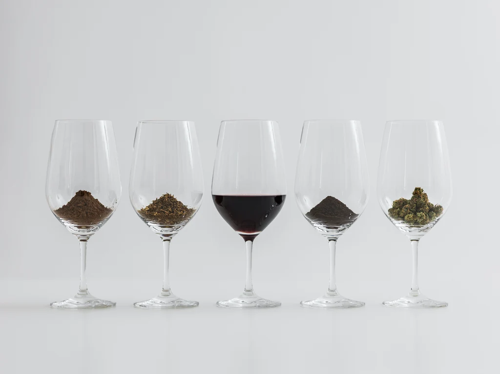 cocoa, chocolate and weed flower displayed in glasses