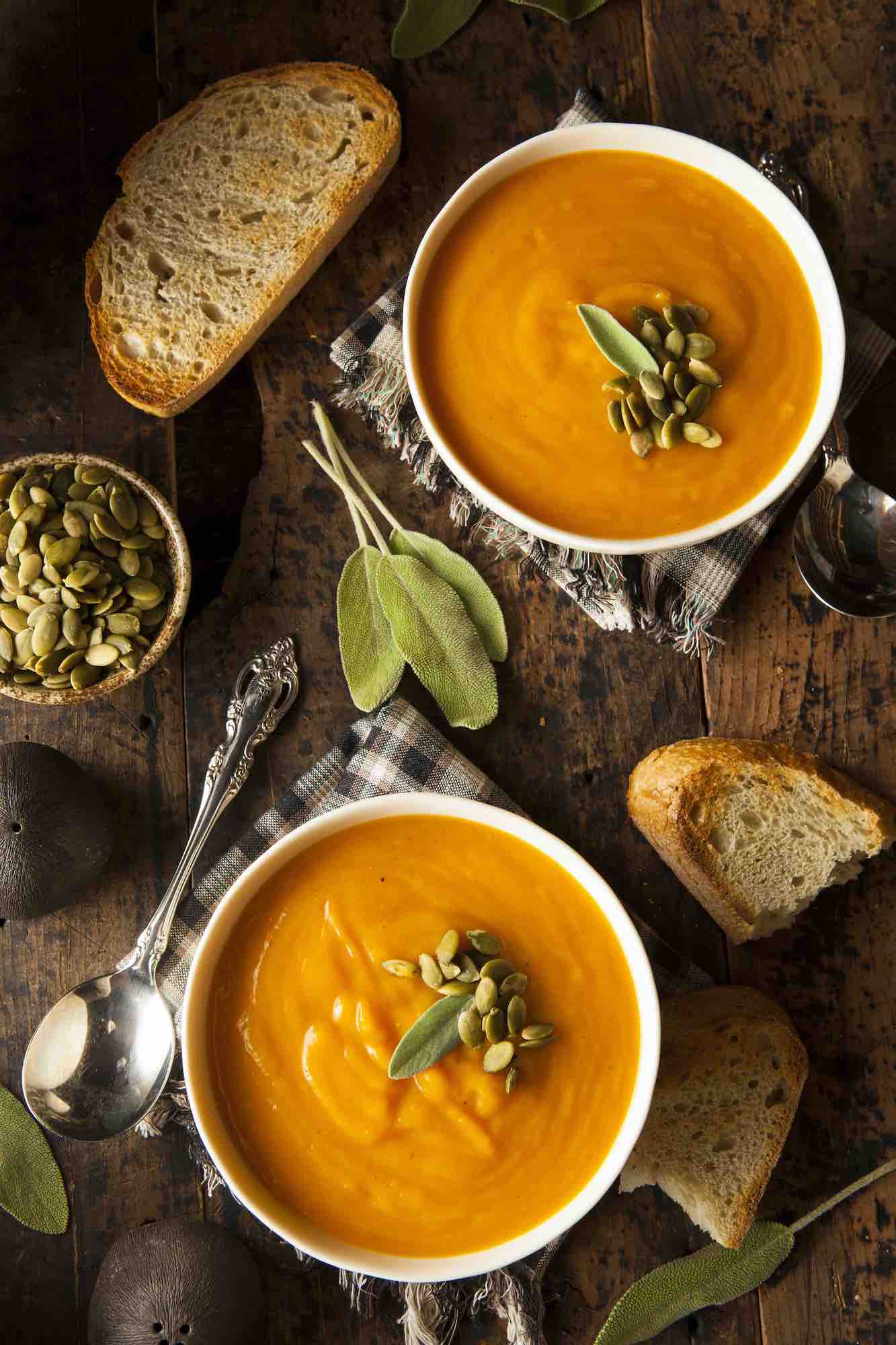 Two completed bowls of butternut squash soup